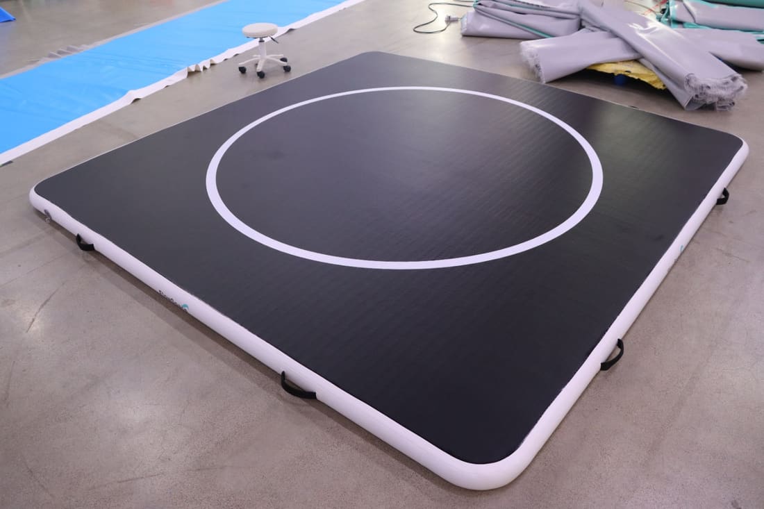 A 10 by 10 FlowMat inflated on the workshop floor before shipping