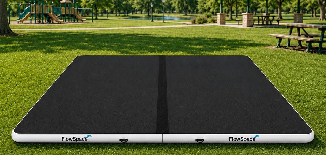The 20 by 15 bundle, two mats joined end to end, set up on grass in a park
