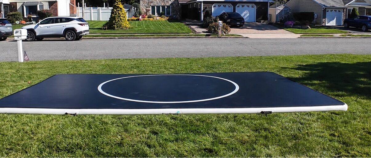 A used Pro FlowMat, fully inflated on a front lawn